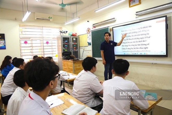 Bộ GDĐT đã giải đáp vướng mắc về thăng hạng với giáo viên THCS, trong đó có trường hợp đã đủ thời gian giữ hạng nhưng chưa được chuyển sang mã số mới. Ảnh: Tường Vân